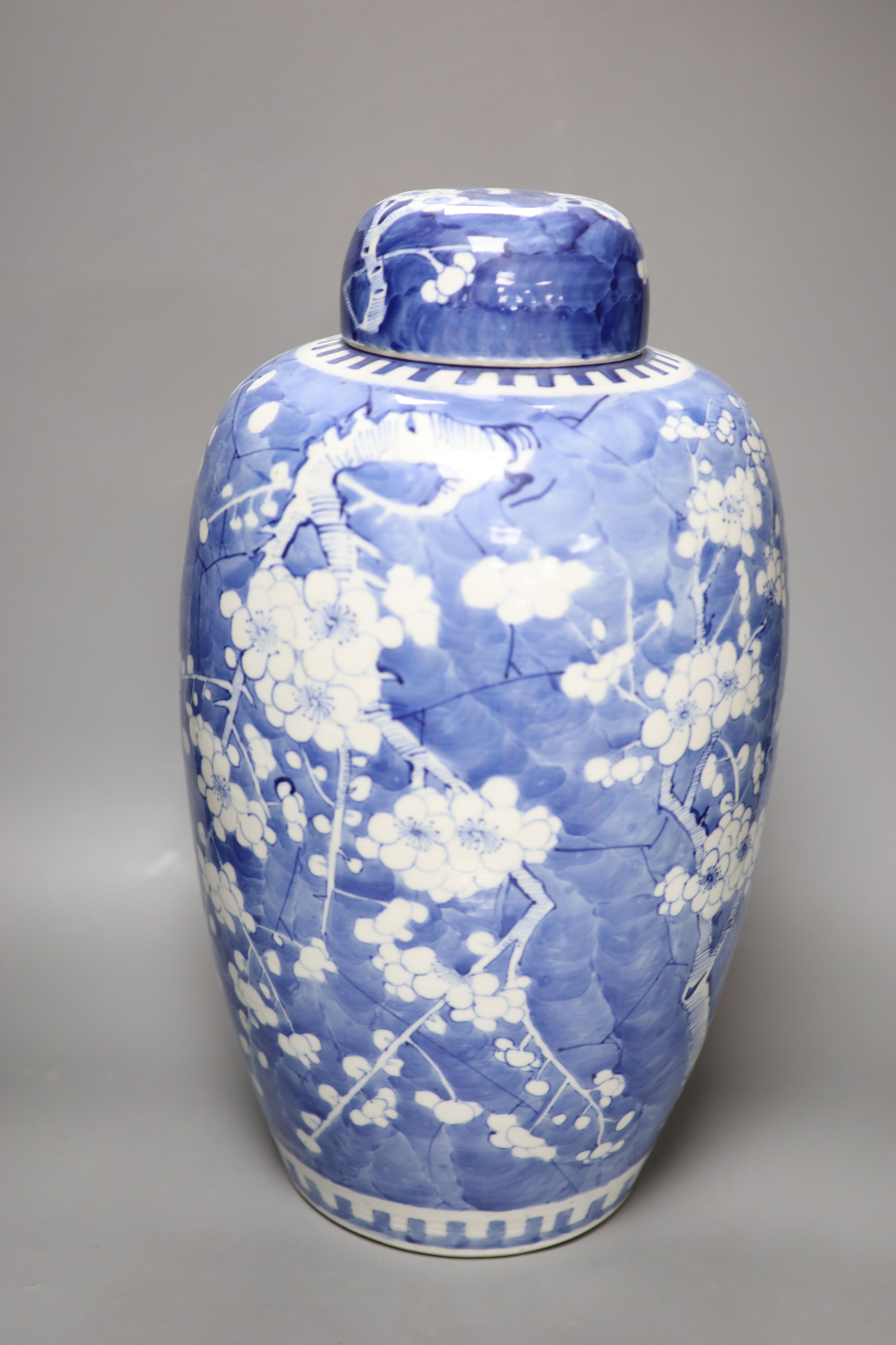 A tall 19th century Chinese blue and white lidded vase and a pair of lidded ginger jars, tallest 45cm